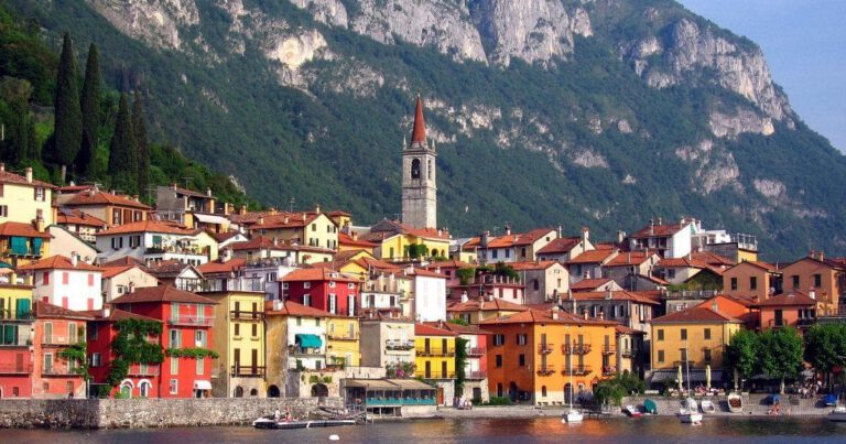 Colorful buildings by serene lake
