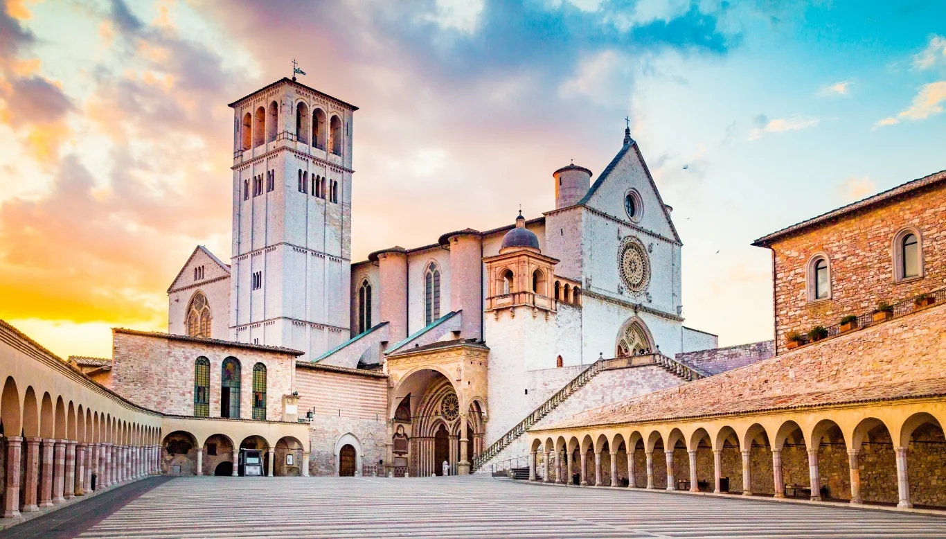 Basilica of St Francis Assisi Italy at sunset — private pilgrimage tours with Italy Charme