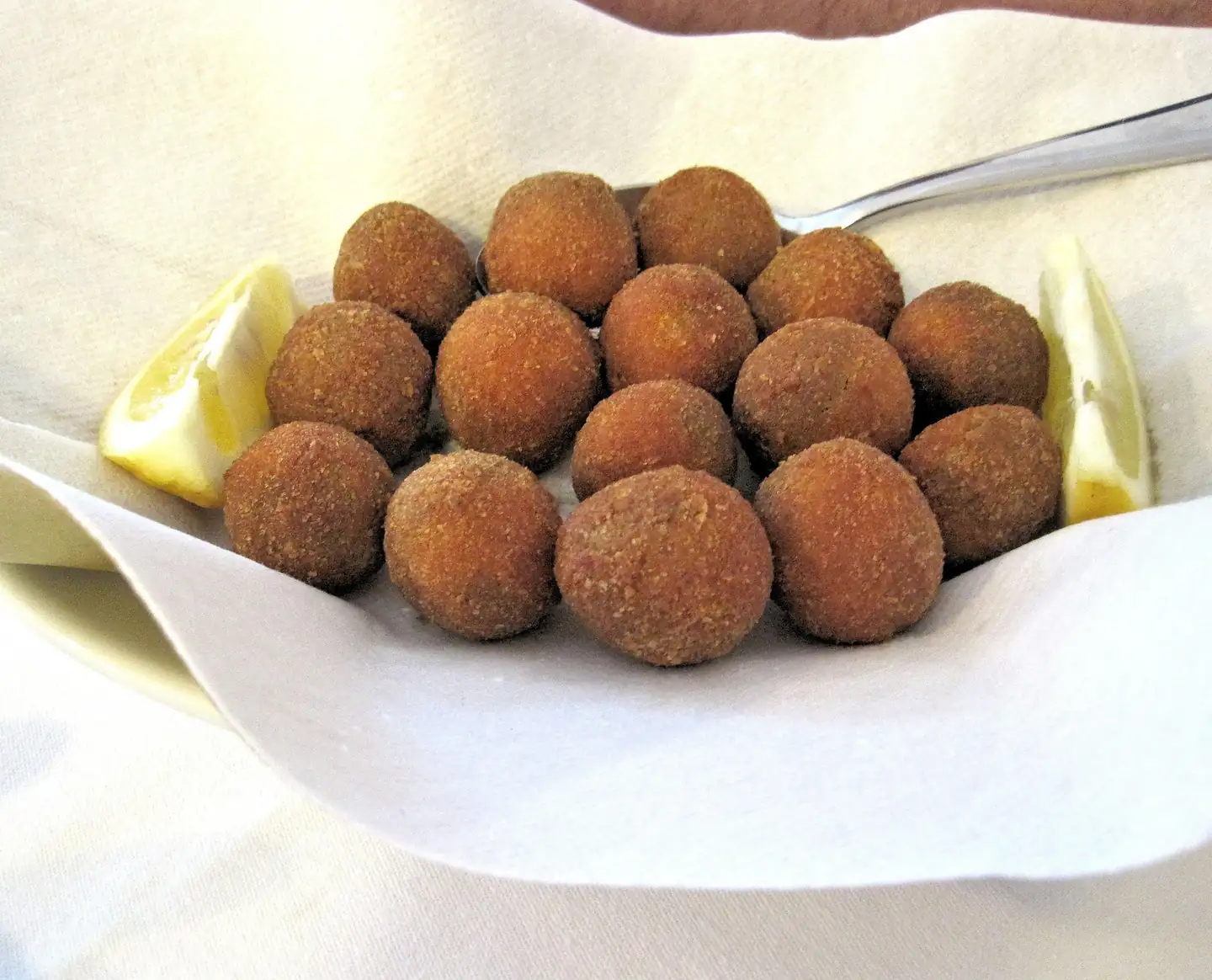Olive all'ascolana, fried stuffed olives from Le Marche, served with lemon