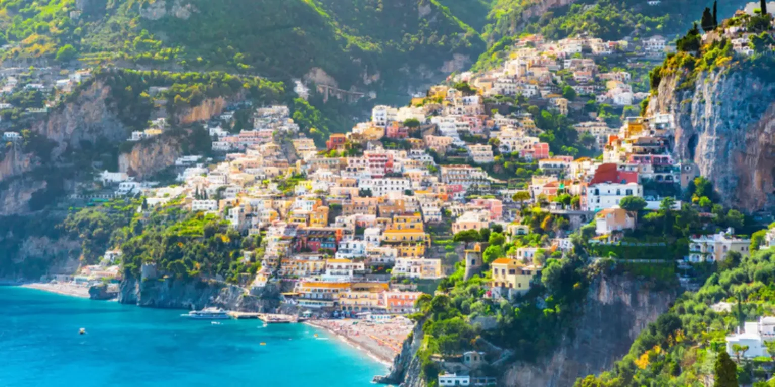 Positano on the Amalfi Coast, with colorful houses climbing the cliffs above the beach